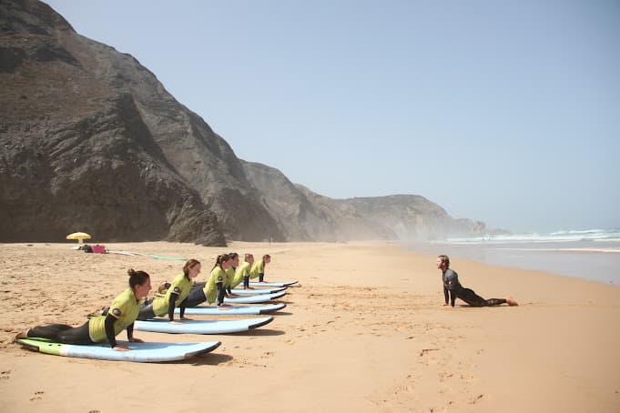 Surf instructor teaching a group of students.