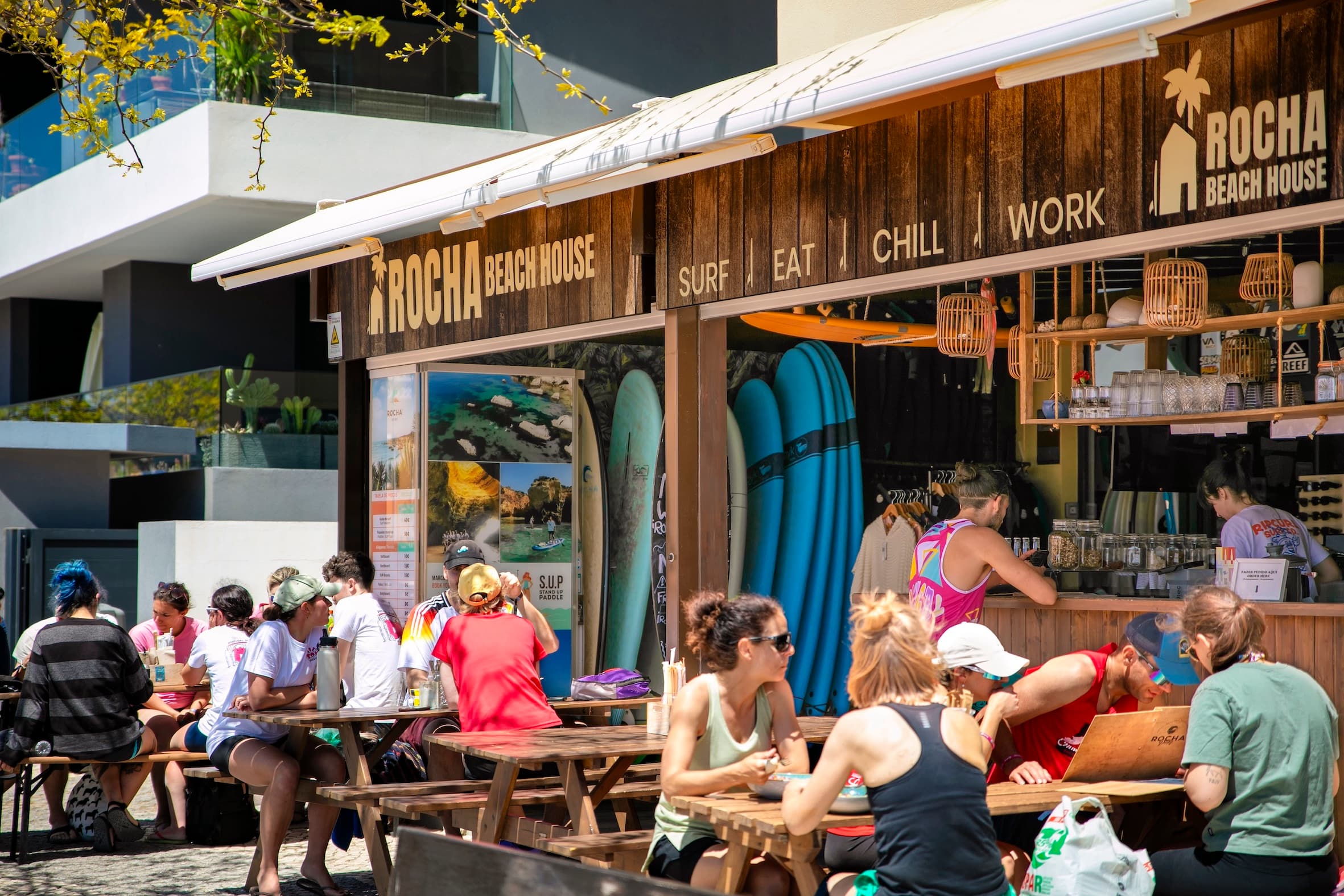 Rocha Beach House outside view with people sitting outside and enjoying their food and beverages.
